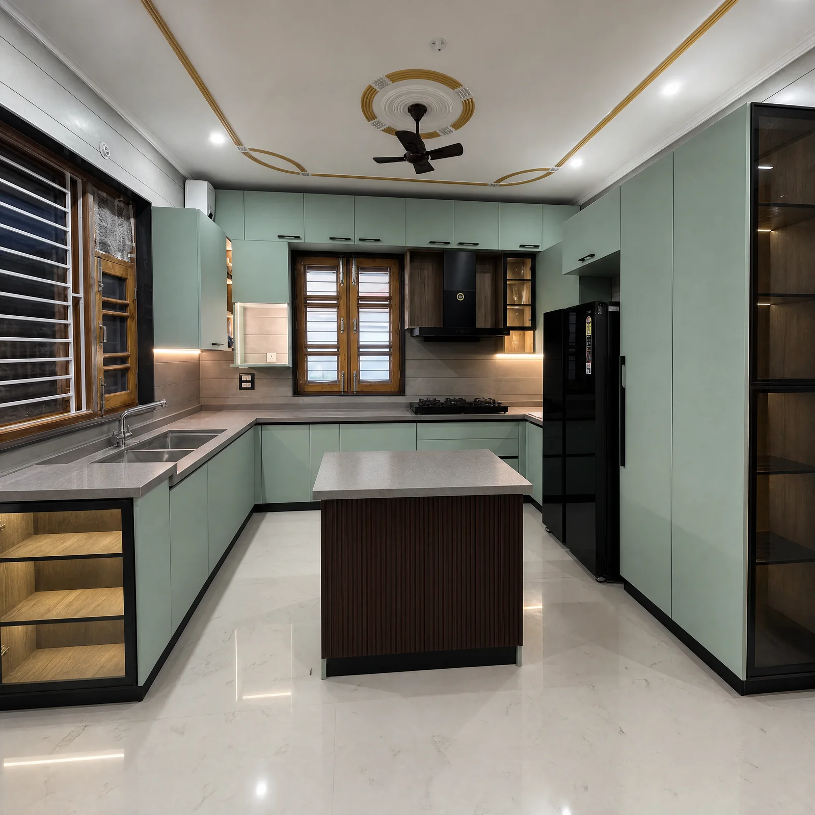 Sage-green modular kitchen with dark ribbed island and walnut display unit